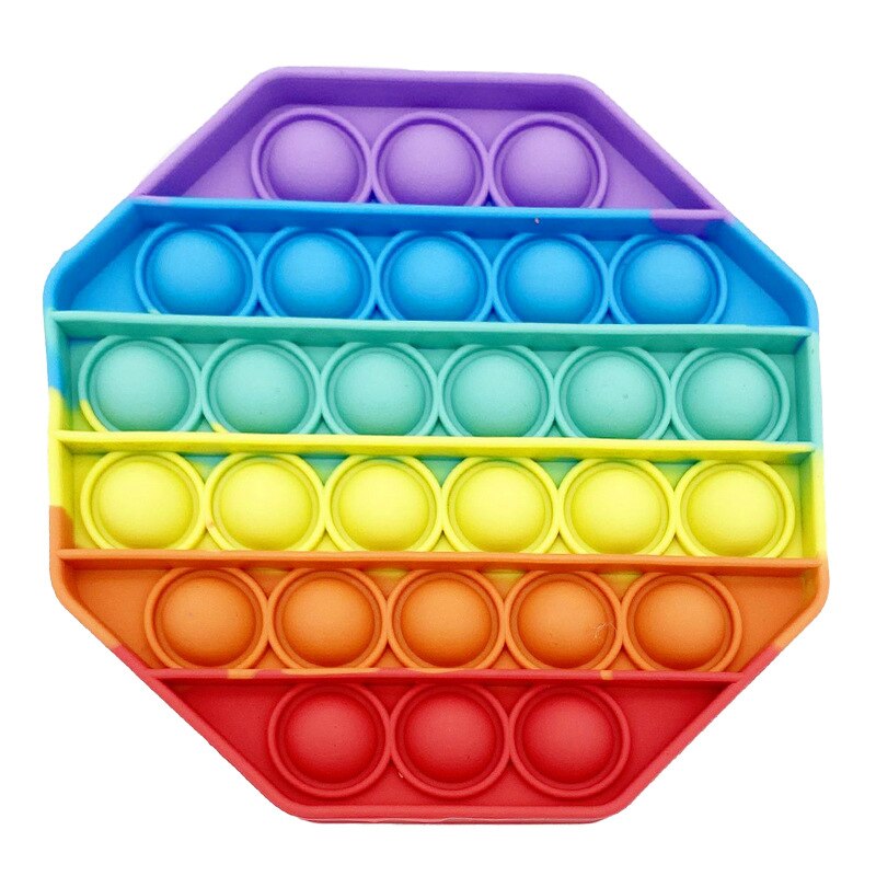 1 Jouet sensoriel anti stress de forme hexagonale et de couleurs violet, bleue, vert, jaune, orange, et rouge.