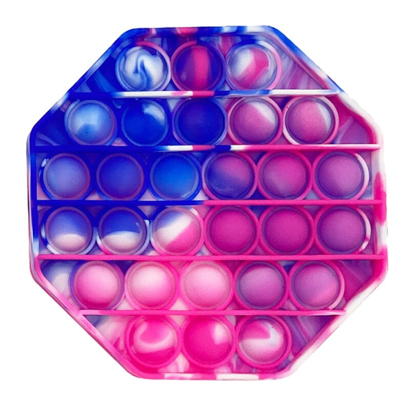 Jouet sensoriel anti stress de forme hexagonale de couleur bleue, rose et blanc.