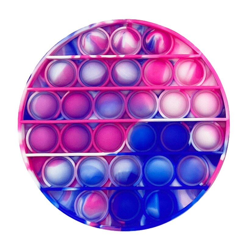 Jouet sensoriel anti stress de forme ronde et de couleur rose, blanc et bleu foncé.