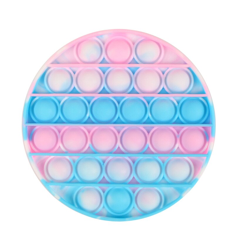 Jouet sensoriel anti stress de forme ronde et de couleur rose, bleue claire et blanc.
